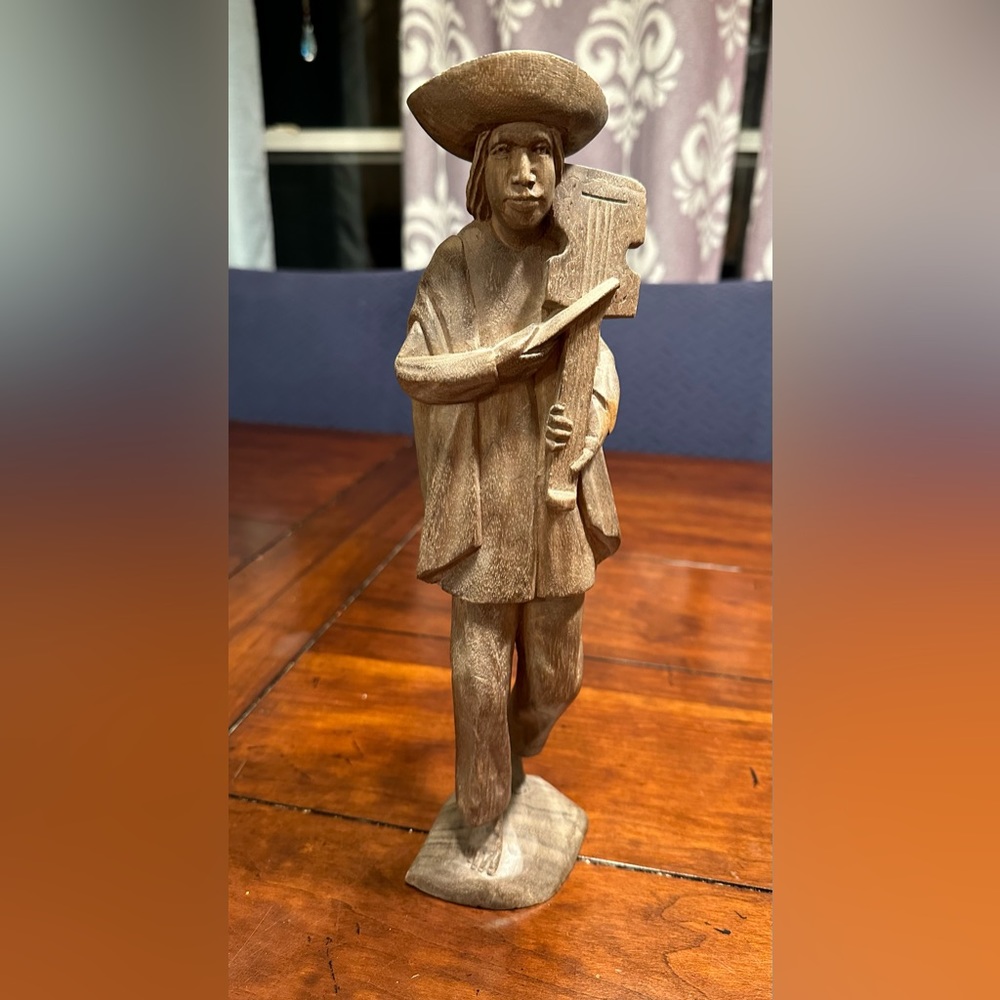 Vintage carved man out of wood playing violin